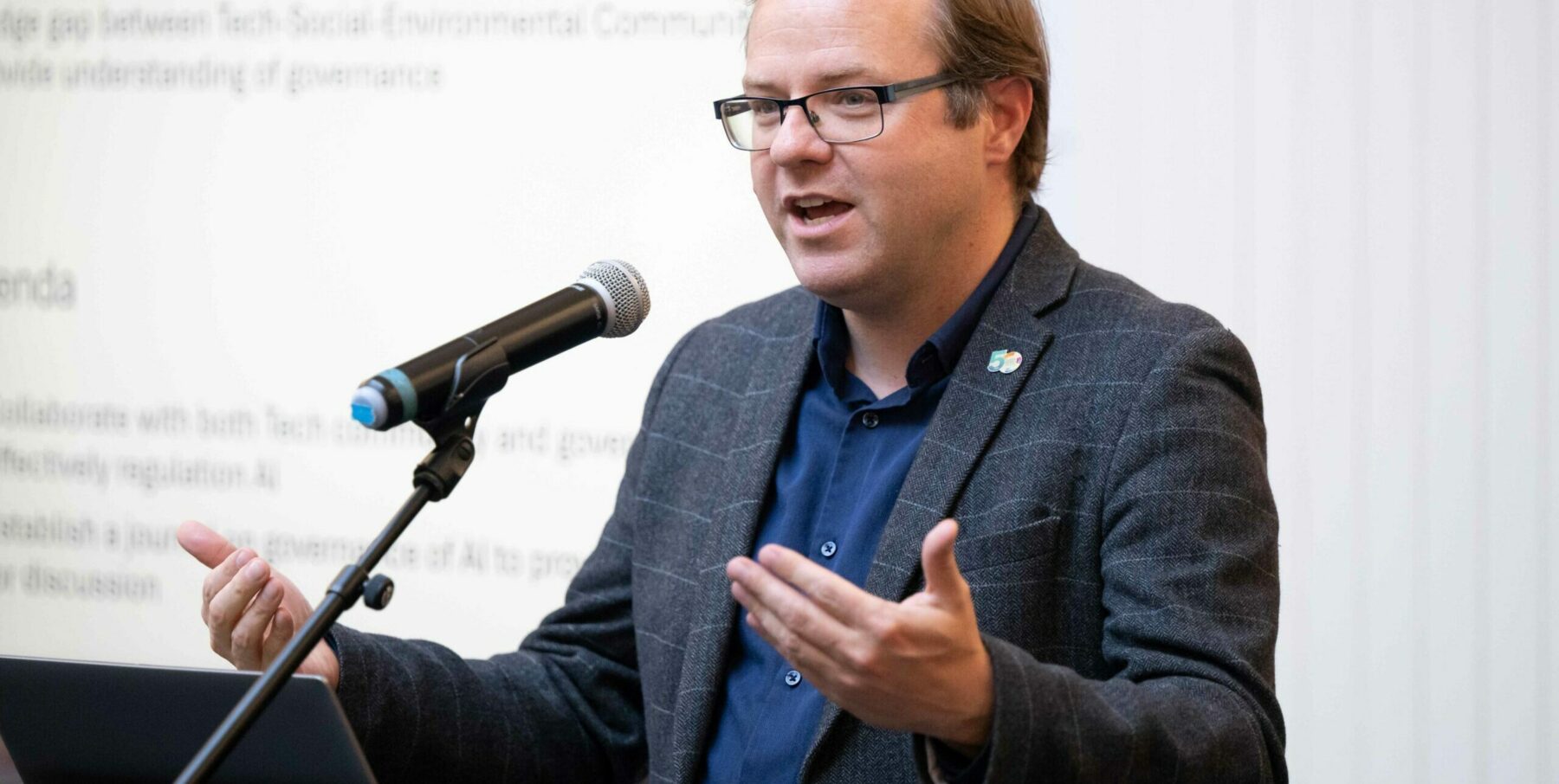 man taking into microphone