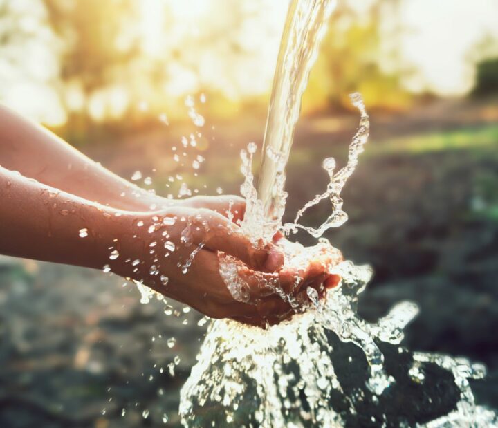 Water falling into cupped hands