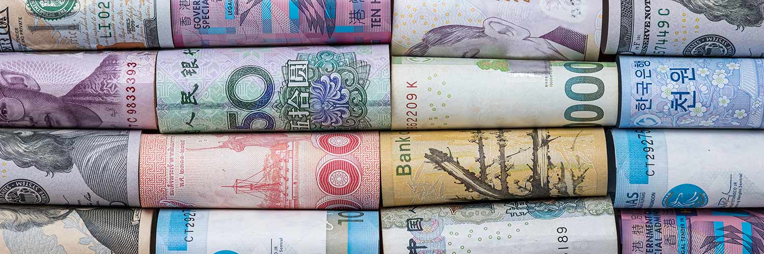 Rolled up banknotes from different countries